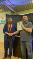 Paul Roberts receives his Honorary Membership Certificate from during lockdown, from former President Nick Marshall